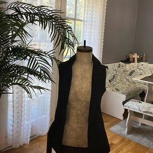 Two pieces: vest brand new- printed skirt excellent condition